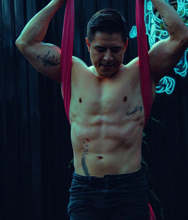 Man performing a controlled strength exercise in a calm, focused environment.